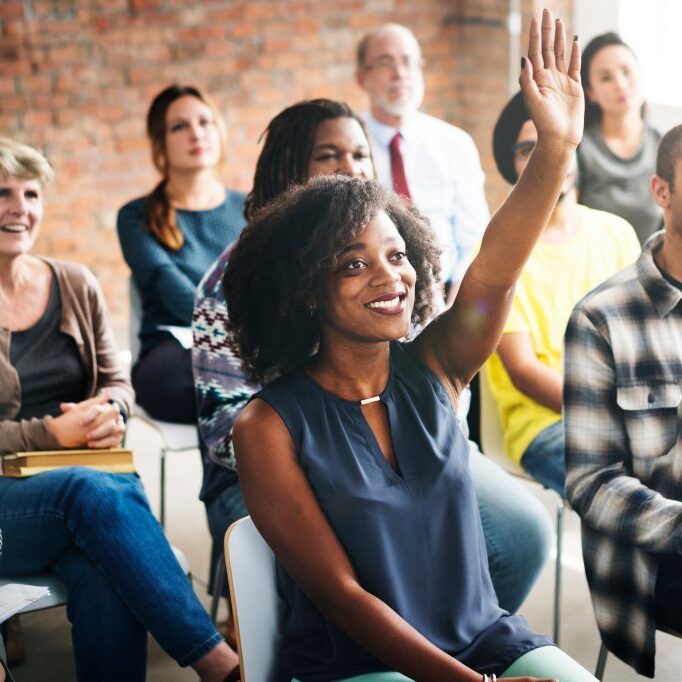 A group of diverse audience in a meeting