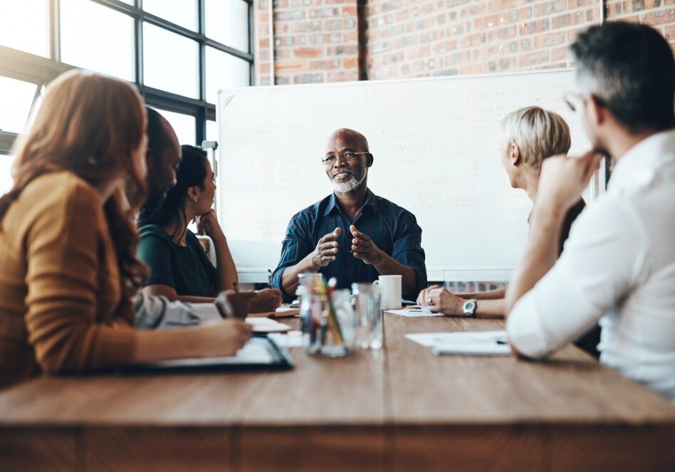 Cropped shot of a mature businessman leading a meeting in the boardroom